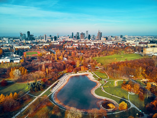 A beautiful panoramic view of the sunset in a fabulous November autumn evening at sunset from drone at Pola Mokotowskie in Warsaw, Poland - Mokotow Field is a large park called "Jozef Pilsudski Park"