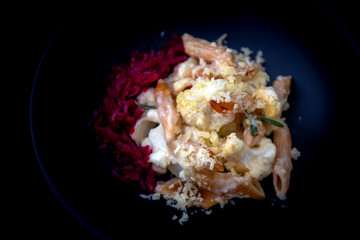 Cheese bakded cauliflower and red lentils spirals