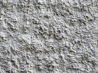 rough gray concrete wall texture with shadows