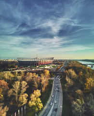 Beautiful sunset panoramic aerial drone view to panorama of Warsaw modern City with skyscraper and The PGE Narodowy National Stadium (Polish: Stadion Narodowy) © udmurd