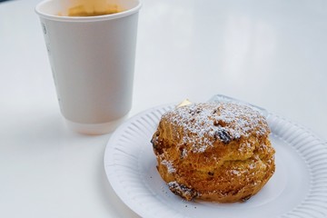 Fruit scone jam and butter with coffee