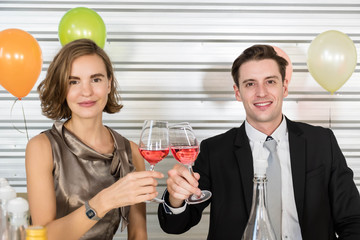 A couple is enjoying a romantic party.