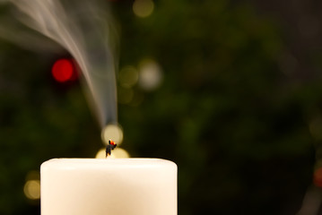 Extinct candle with a smoking wick, close up