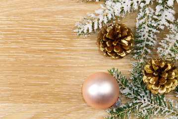 Pine cone close up with Christmas decoration on background.