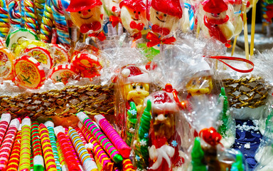 Lollipop candies in Christmas market in Lithuania Europe in winter. Sweet food at Lithuanian Night street Xmas and holiday fair European city or town, December. Vilnius