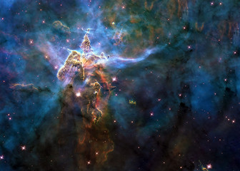 Mystic Mountain of Carina Nebula. Deep space look. Science fiction wallpaper. Elements of this image were furnished by NASA.