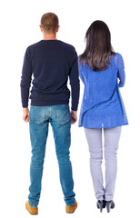 Back view of couple. beautiful friendly girl and guy together.