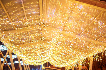 Christmas decorations on the street, colorful holiday bokeh lights, city night illumination