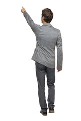 Back view of walking pointing business man.