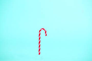 Christmas candy on turquoise background.Creative trendy background