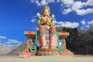 Lord Buddha statue against blue sky, Diskit Monastery in Nubra Valley, Leh, Ladakh 