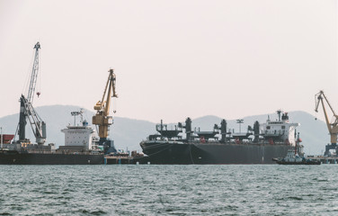 Fototapeta premium Logistics and transportation of International Container Cargo ship in the ocean at Sunshine sky, Freight Transportation, Shipping