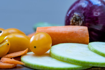Colored tomatoes, carrots and other rich vegetables for a healthy salad
