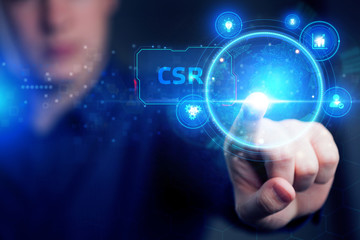 Planning marketing strategy. Business, Technology, Internet and network concept. Young businessman shows the word: CSR