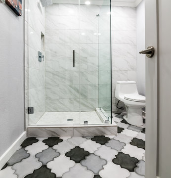 Grey and White Bathroom with Marble shower and Moroccan tile flooring, neutral, plain