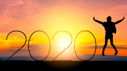 Silhouette young woman jumping to 2020 new year