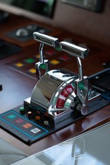 beautiful vertical shot of a shining metal yacht throttle © Christophe Paitrault/Wirestock