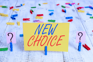 Writing note showing New Choice. Business concept for having lot of options and adding another one to choose between Crumbling sheet with paper clips placed on the wooden table