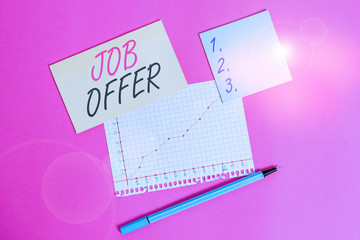 Writing note showing Job Offer. Business concept for Demonstrating or company that gives opurtunity for one employment Stationary and note paper math sheet with diagram picture on the table