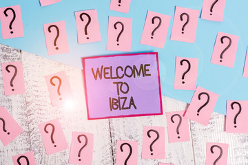 Handwriting text Welcome To Ibiza. Conceptual photo Warm greetings from one of Balearic Islands of Spain Scribbled and crumbling papers with thick cardboard above wooden table
