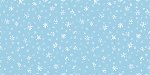 Snowflakes seamless background. Subtle vector pattern with small hand drawn white snowflakes on blue backdrop. Winter holidays theme, Christmas and New Year texture. Elegant repeat design for decor
