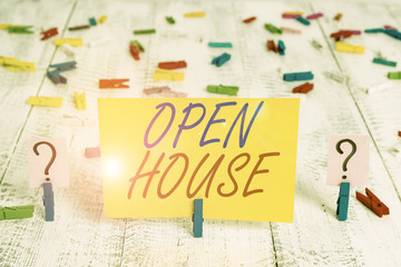 Writing note showing Open House. Business concept for a place or situation in which all visitors are welcome to go in Crumbling sheet with paper clips placed on the wooden table