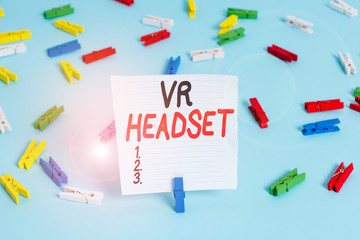 Word writing text Vr Headset. Business photo showcasing headmounted device that provides virtual reality for the wearer Colored clothespin papers empty reminder blue floor background office pin