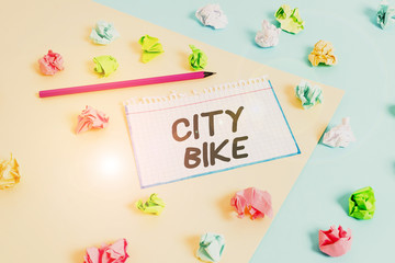 Word writing text City Bike. Business photo showcasing designed for regular short rides through equally flat urban areas Colored crumpled papers empty reminder blue yellow background clothespin