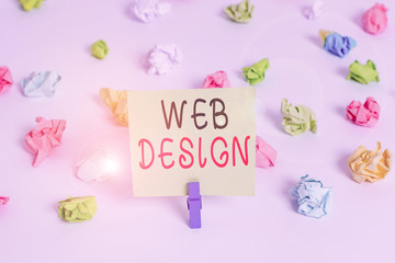 Word writing text Web Design. Business photo showcasing Website development Designing and process of creating websites Colored crumpled papers empty reminder white floor background clothespin