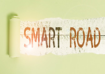 Conceptual hand writing showing Smart Road. Concept meaning number of different ways technologies are incorporated into roads Cardboard which is torn placed above a wooden classic table