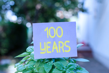 Handwriting text 100 Years. Conceptual photo Remembering special day for being 100 years in...