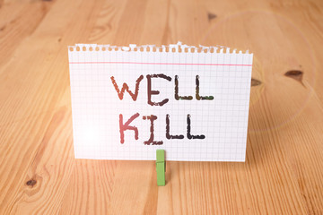 Word writing text Well Kill. Business photo showcasing operation of placing a column of heavy fluid into a well bore Empty reminder wooden floor background green clothespin groove slot office