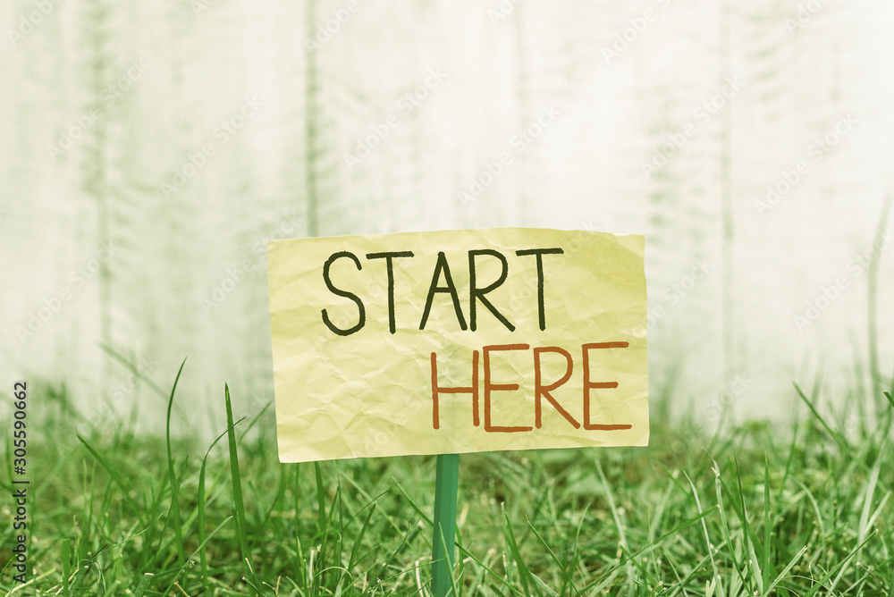 Aufkleber handwriting text writing start here. conceptual photo telling someone this is beginning point to go 
