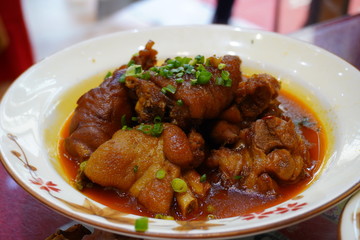 Traditional Szechuan style braised pork knuckles with chili and spices.