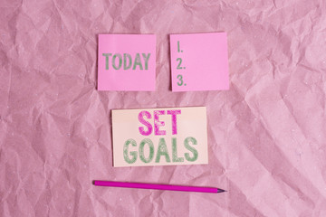 Handwriting text Set Goals. Conceptual photo Defining or achieving something in the future based on plan Papercraft craft paper desk square spiral notebook office study supplies