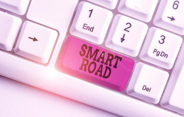 Word writing text Smart Road. Business photo showcasing number of different ways technologies are incorporated into roads White pc keyboard with empty note paper above white background key copy space