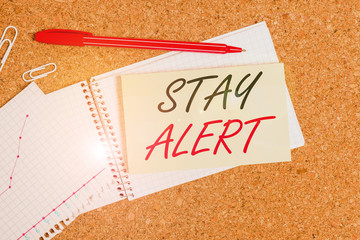 Handwriting text Stay Alert. Conceptual photo Paying full attention to things around Quick to see or understand Desk notebook paper office cardboard paperboard study supplies table chart