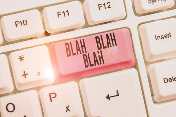 Writing note showing Blah Blah Blah. Business concept for Talking too much false information gossips nonsense speaking Keyboard with note paper on white background key copy space
