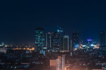 Bangkok night view with skyscraper in business district in Bangkok Thailand