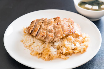 teriyaki pork on topped rice with miso soup