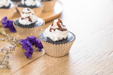 chocolate cup cake with whipped cream