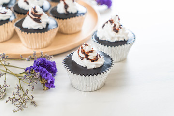 chocolate cup cake with whipped cream