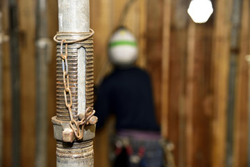 Formwork construction: Formwork support systems. and the background, the stripping the timber form off (removed)  