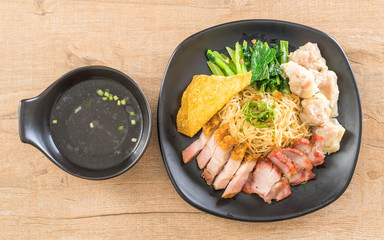 Egg noodle with red roast pork, crispy pork, dumplings and soup