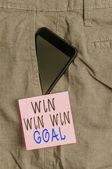 Handwriting text Win Win Win Goal. Conceptual photo Approach that aims to satisfy all parties involved Smartphone device inside formal work trousers front pocket near note paper