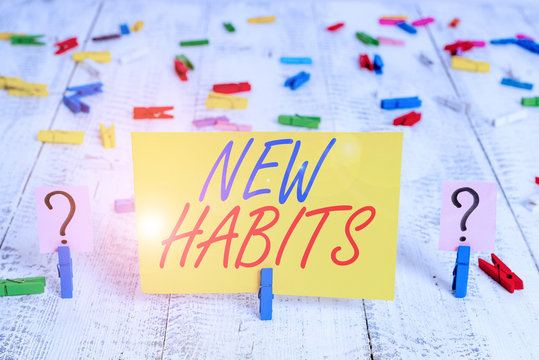 Writing note showing New Habits. Business concept for change the routine of behavior that is repeated regularly Crumbling sheet with paper clips placed on the wooden table