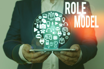 Writing note showing Role Model. Business concept for a demonstrating looked to by others as an...