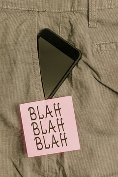 Handwriting text Blah Blah Blah. Conceptual photo Talking too much false information gossips nonsense speaking Smartphone device inside formal work trousers front pocket near note paper
