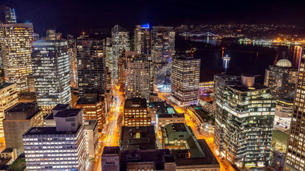 Fototapeta na wymiar Vancouver, British Columbia, Canada. Aerial city view of downtown, taken during a chill night after a beautiful sunset.