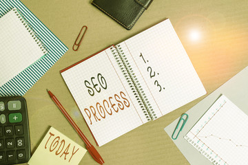 Text sign showing Seo Process. Business photo showcasing steps of increasing the quality and quantity of website traffic Striped paperboard notebook cardboard office study supplies chart paper
